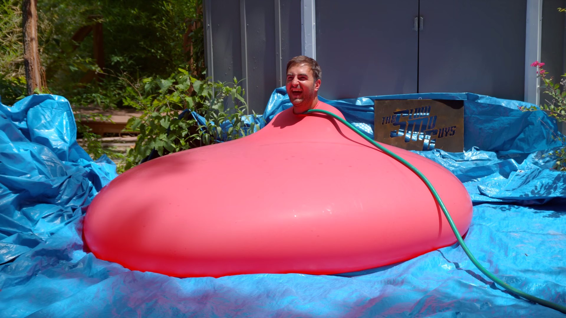 Watch A 6-Foot Water Balloon Pop In Slow Motion With A 6-Foot Man Stuffed I...