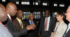 Foreign Affairs and Foreign Trade Minister, Senator the Hon. Kamina Johnson Smith (second right), having a light exchange with Chairperson of the Jamaica Diaspora Education Task Force, Leo Gilling (second left), on the first of the two-day 2nd Biennial Advancement in Education Summit at Jamaica College, on Old Hope Road in Kingston, on March 23. Others (from left) are: President of the Jamaica Teachers’ Association (JTA), Norman Allen; President of the Mico University College, Dr. Ashburn Pinnock; Executive Director of the Jamaica Diaspora Institute, Professor Neville Ying; Education, Youth and Information Minister, Senator the Hon. Ruel Reid and Opposition Spokesperson on Education and Training, Rev. Ronald Thwaites.